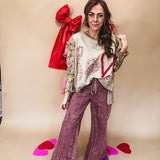 Washed wine colored wide leg cargo pants with drawstring waist.