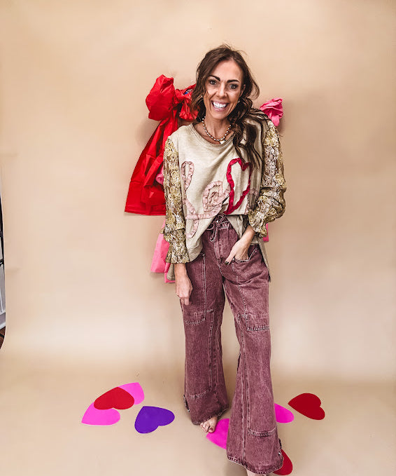 Washed wine colored wide leg cargo pants with drawstring waist.