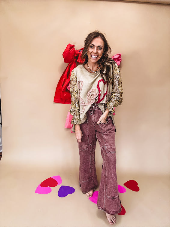 Washed wine colored wide leg cargo pants with drawstring waist.
