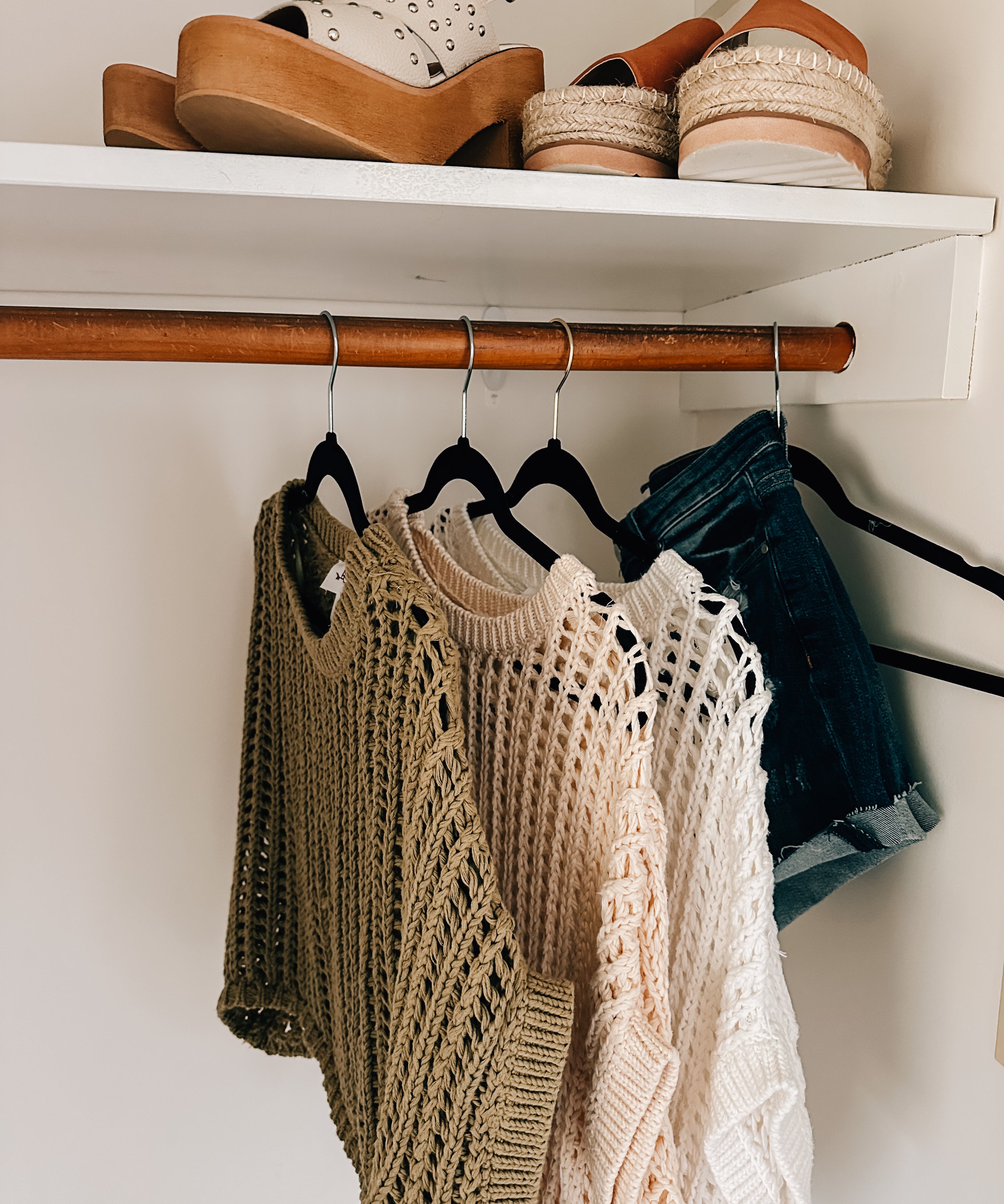 Open weave short sleeved waist length sweater available in many colors.