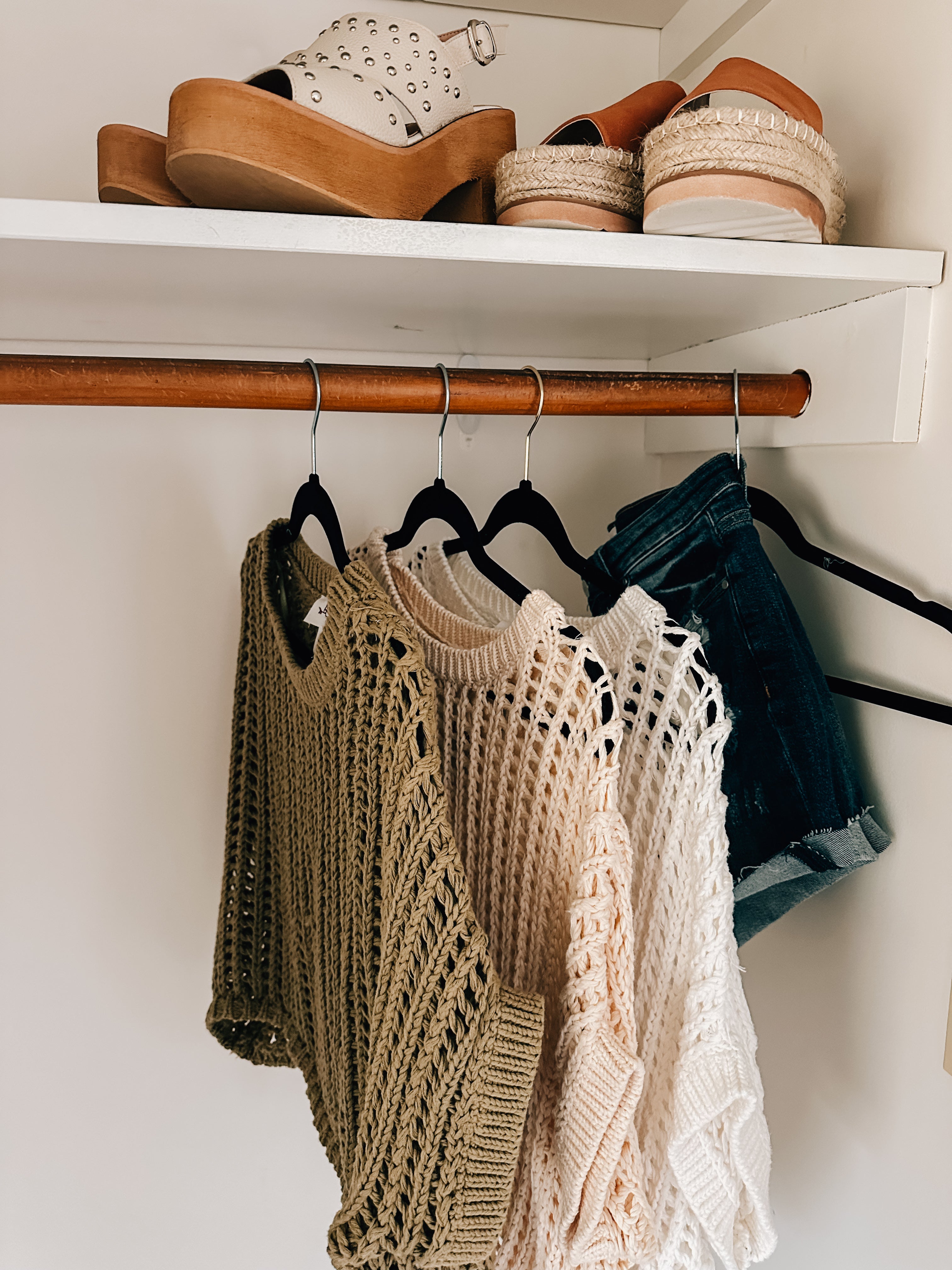 Open weave short sleeved waist length sweater available in many colors.