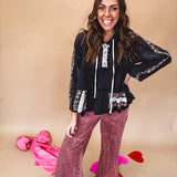 Black washed empire waist hoodie with green and pink floral embroidery and lace down the sleeves, on the patchwork and on the back