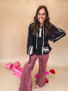 Washed wine colored wide leg cargo pants with drawstring waist.