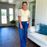 Dark wash four-way stretch denim from Risen with a classic flared leg and a high rise cut. With zero distressing,