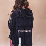 Black washed empire waist hoodie with green and pink floral embroidery and lace down the sleeves, on the patchwork and on the back