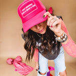Neon pink puffy trucker hat with "That Sounds Like A Man's Job" in white embroidery.