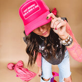 Neon pink puffy trucker hat with "That Sounds Like A Man's Job" in white embroidery.