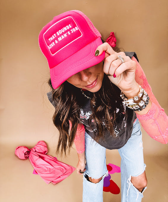 Neon pink puffy trucker hat with "That Sounds Like A Man's Job" in white embroidery.