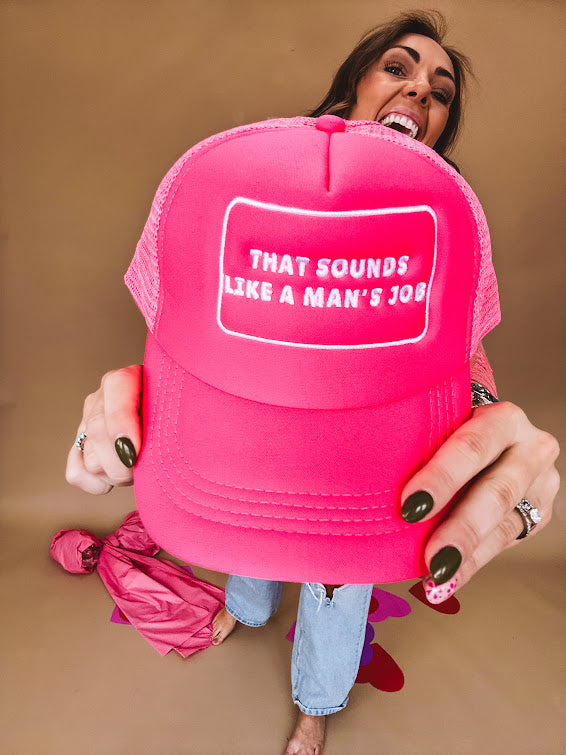 Neon pink puffy trucker hat with "That Sounds Like A Man's Job" in white embroidery.