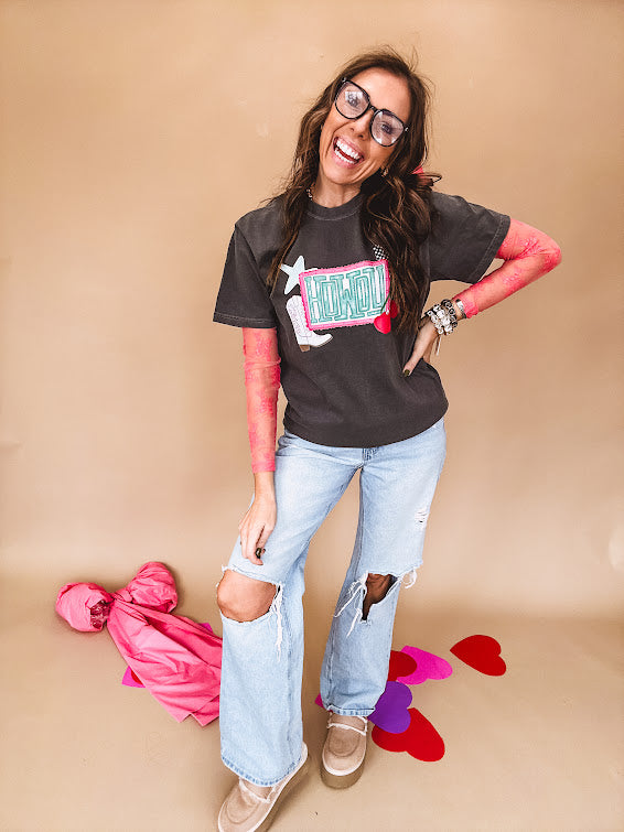 Charcoal cotton tee with pink, teal, white and red and "Howdy", cherries and a white and black checkered lightning bolt graphics.