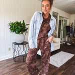 Crafted from a soft cotton-poly blend, these lightweight joggers feature an eye-catching western print complete with boots, hats, horses, and horseshoes across a warm brown base. With wide-leg silhouette, elastic drawstring waist, and functional pockets.
