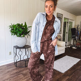 Crafted from a soft cotton-poly blend, these lightweight joggers feature an eye-catching western print complete with boots, hats, horses, and horseshoes across a warm brown base. With wide-leg silhouette, elastic drawstring waist, and functional pockets.