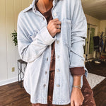 Light blue acid wash shacket, cotton with a terry-like feel, oversized front pockets, a classic collar, and chunky silver buttons, rounded hem and relaxed fit.