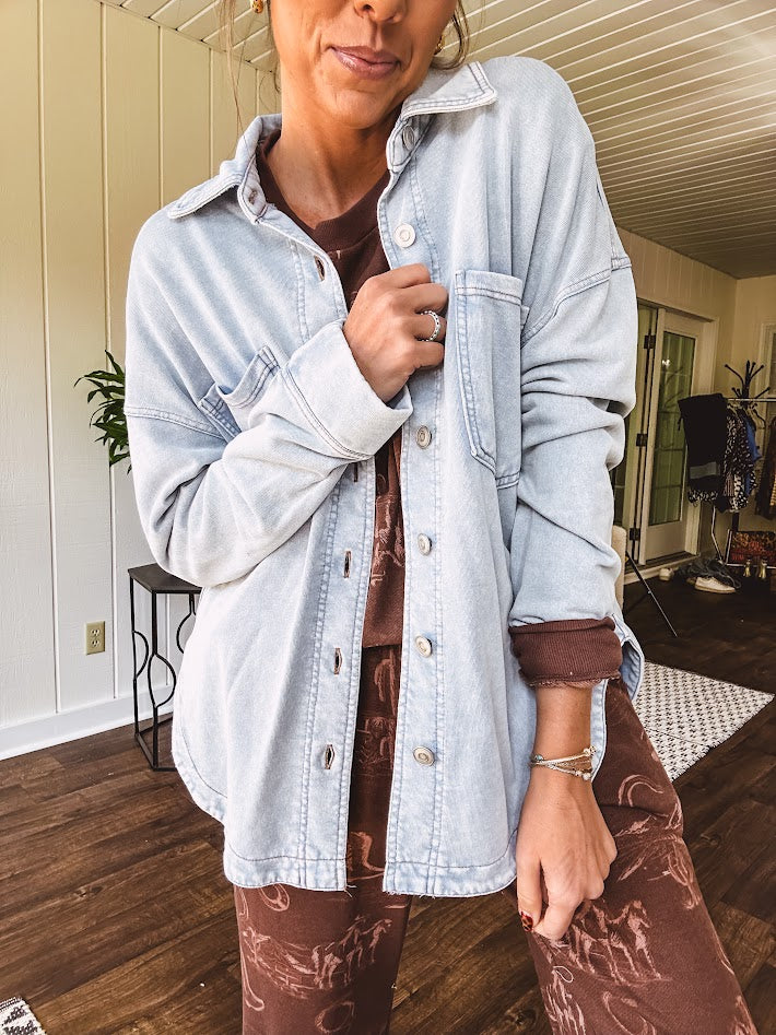 Light blue acid wash shacket, cotton with a terry-like feel, oversized front pockets, a classic collar, and chunky silver buttons, rounded hem and relaxed fit.