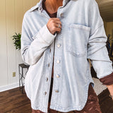 Light blue acid wash shacket, cotton with a terry-like feel, oversized front pockets, a classic collar, and chunky silver buttons, rounded hem and relaxed fit.
