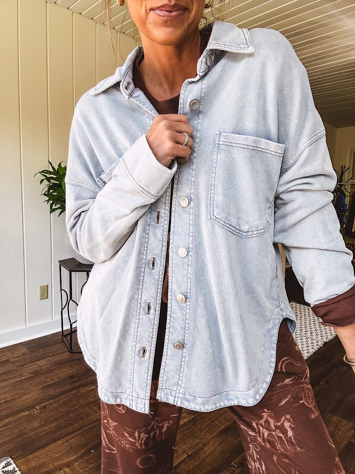 Light blue acid wash shacket, cotton with a terry-like feel, oversized front pockets, a classic collar, and chunky silver buttons, rounded hem and relaxed fit.