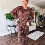 Crafted from a soft cotton-poly blend, these lightweight joggers feature an eye-catching western print complete with boots, hats, horses, and horseshoes across a warm brown base. With wide-leg silhouette, elastic drawstring waist, and functional pockets.