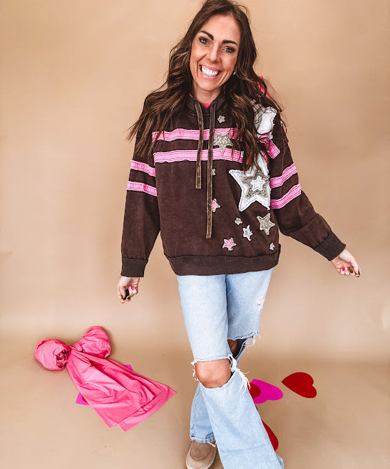 Charcoal hoodie with pink stripes, inside of hood and white and floral star patchwork throughout.