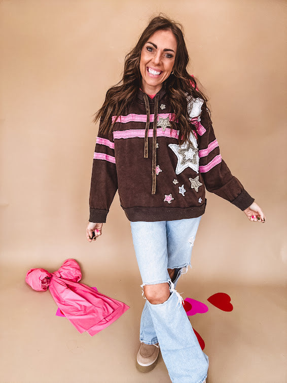 Charcoal hoodie with pink stripes, inside of hood and white and floral star patchwork throughout.