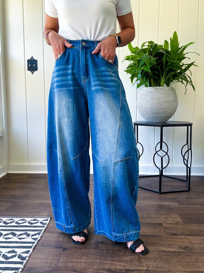 Panel Seam Jeans in Light. Featuring a bold wide-leg silhouette crafted from lightweight light denim, these jeans turn heads with their retro wash and striking contrast stitching and upside-down design at the leg openings.
