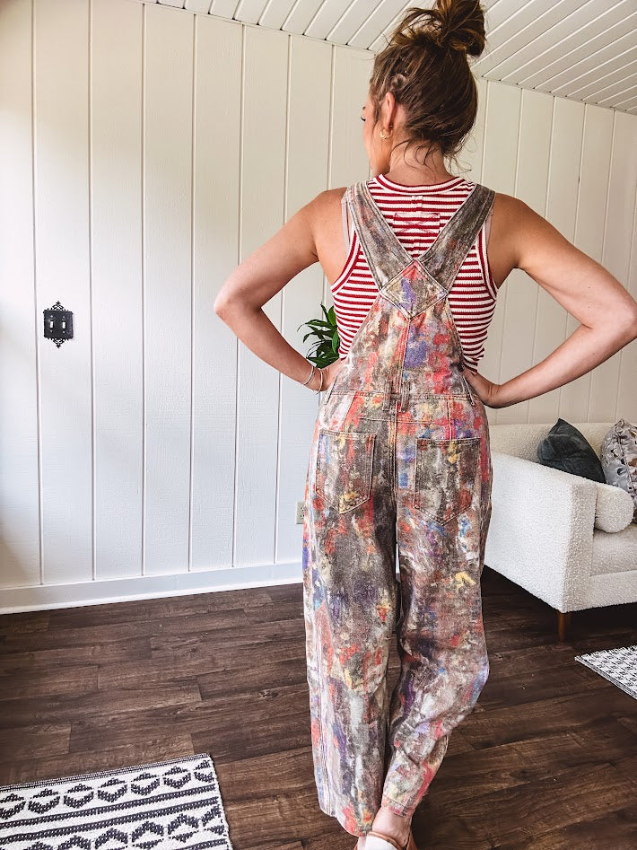 Waffle texture tank with deep round neckline and functional 1/4 button front and wide straps.