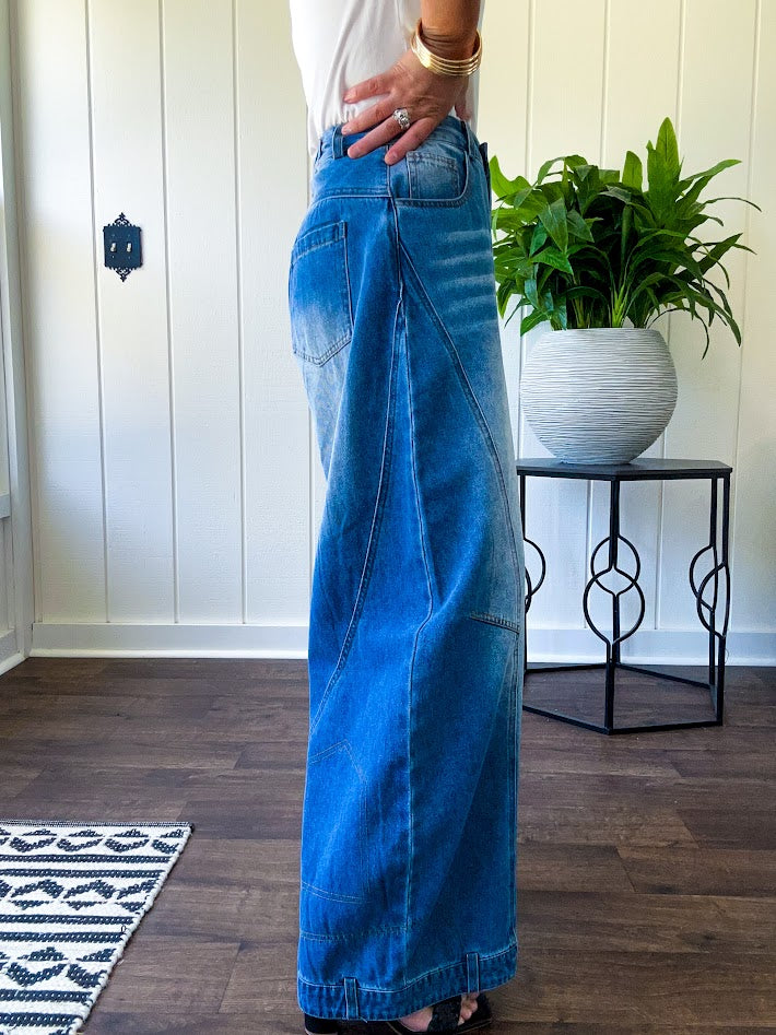 Panel Seam Jeans in Light. Featuring a bold wide-leg silhouette crafted from lightweight light denim, these jeans turn heads with their retro wash and striking contrast stitching and upside-down design at the leg openings.