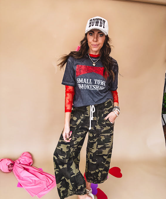 Long sleeved sheer red mesh with floral bundles throughout.