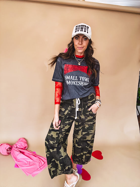 Long sleeved sheer red mesh with floral bundles throughout.