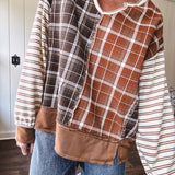 Plaid pullover pairs earth-tone mocha, cream, and rust with playful contrasting stripes on the sleeves with a split neck and relaxed fit.