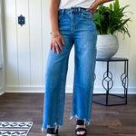 Comfort-stretch denim with a soft, flexible feel
Flattering high-rise fit
Classic five-pocket styling
Unique slant side seam detailing for added dimension
Trendy uneven raw hem finish
Ankle-length wide-leg silhouette
Medium wash denim