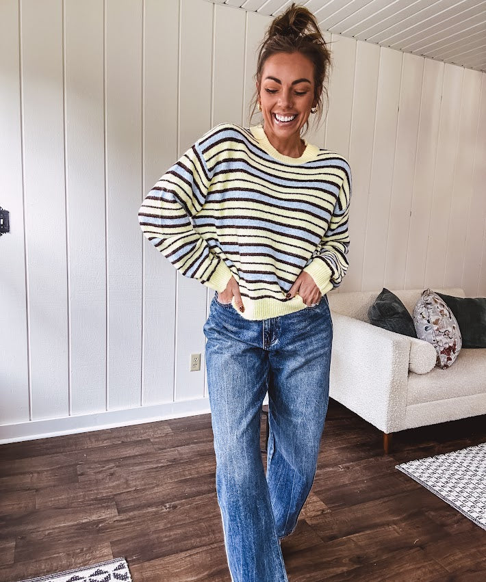 Butter yellow striped knit top with horizontal stripes in dark brown and light blue, a relaxed fit and square hem.