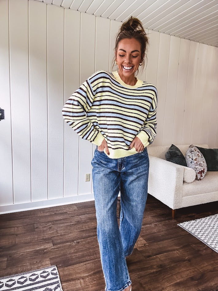 Butter yellow striped knit top with horizontal stripes in dark brown and light blue, a relaxed fit and square hem.