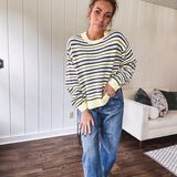 Butter yellow striped knit top with horizontal stripes in dark brown and light blue, a relaxed fit and square hem.