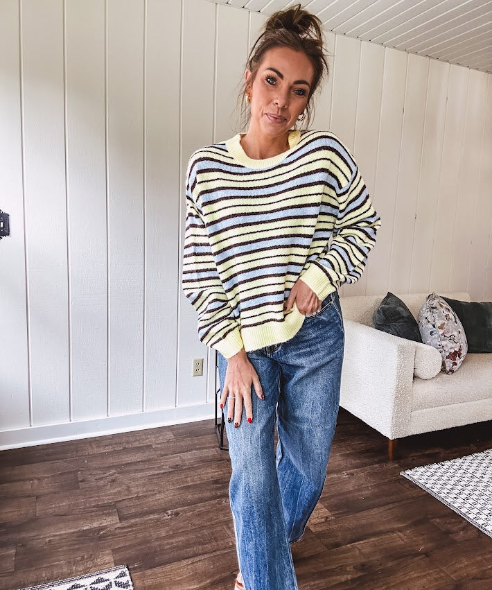 Butter yellow striped knit top with horizontal stripes in dark brown and light blue, a relaxed fit and square hem.