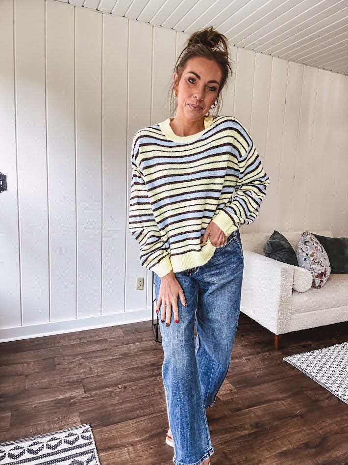 Butter yellow striped knit top with horizontal stripes in dark brown and light blue, a relaxed fit and square hem.
