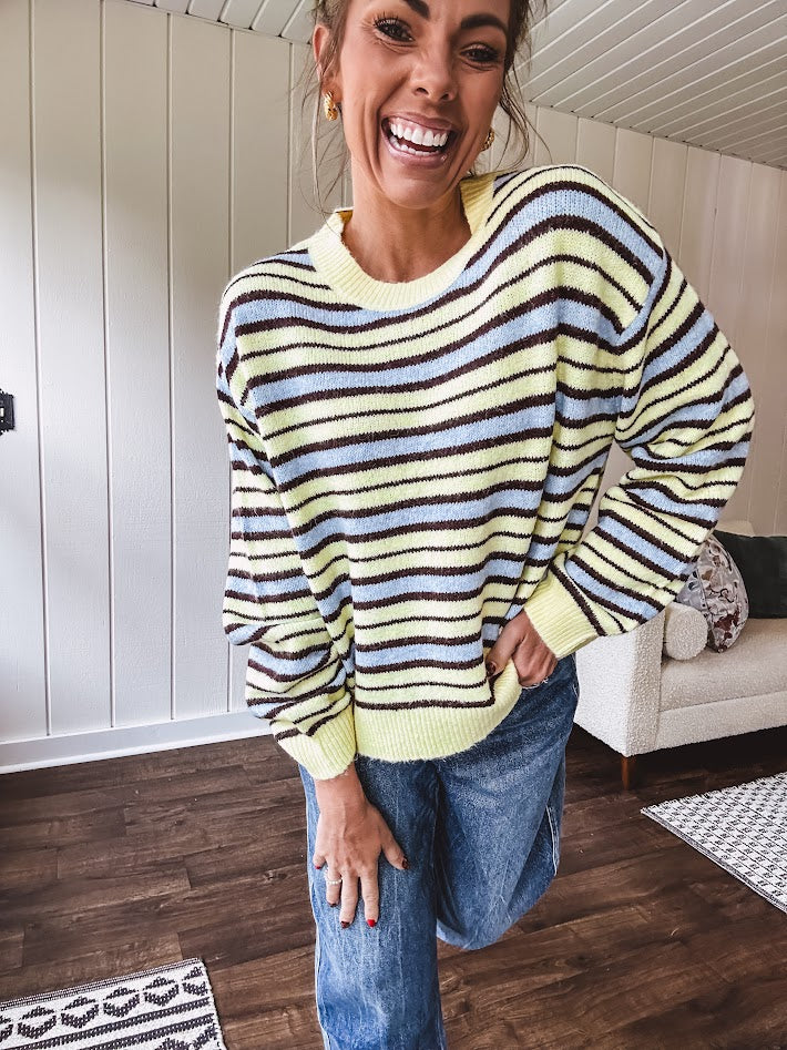 Butter yellow striped knit top with horizontal stripes in dark brown and light blue, a relaxed fit and square hem.
