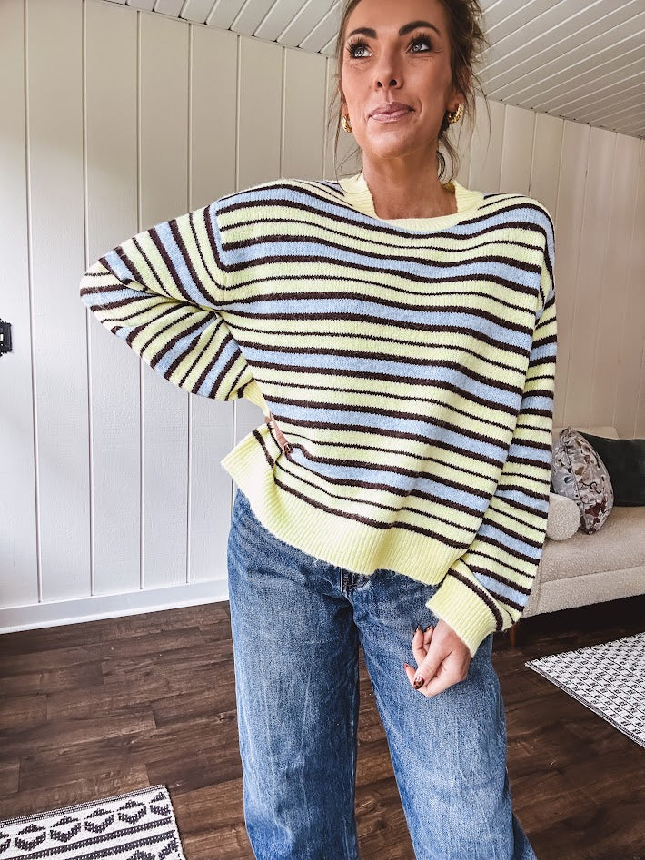 Butter yellow striped knit top with horizontal stripes in dark brown and light blue, a relaxed fit and square hem.