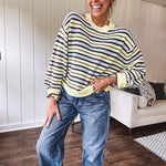 Butter yellow striped knit top with horizontal stripes in dark brown and light blue, a relaxed fit and square hem.