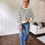 Butter yellow striped knit top with horizontal stripes in dark brown and light blue, a relaxed fit and square hem.