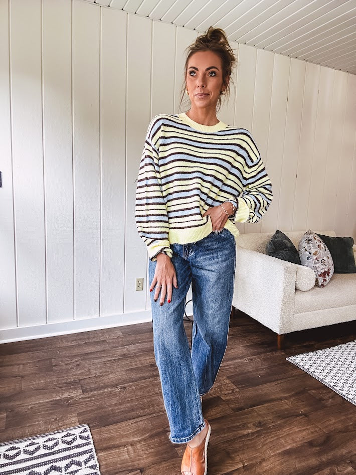 Butter yellow striped knit top with horizontal stripes in dark brown and light blue, a relaxed fit and square hem.