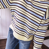 Butter yellow striped knit top with horizontal stripes in dark brown and light blue, a relaxed fit and square hem.