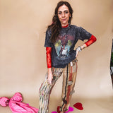 Cotton straight leg ethnic print pants in muted magenta, cream, red, blue and mustard.