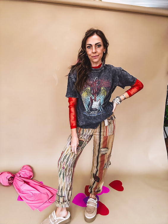 Cotton straight leg ethnic print pants in muted magenta, cream, red, blue and mustard.