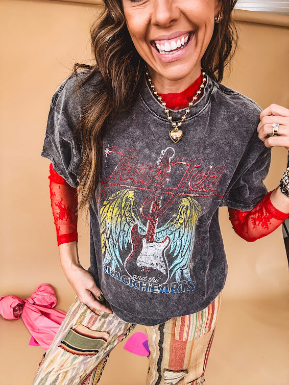 Long sleeved sheer red mesh with floral bundles throughout.