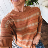 Lightweight, striped drop shoulder sweater tee in a soft sage or rust base  with warm stripes of light brown, taupe, and spice, and ribbed detailing at the neck, cuffs, and hem.