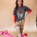Cotton straight leg ethnic print pants in muted magenta, cream, red, blue and mustard.