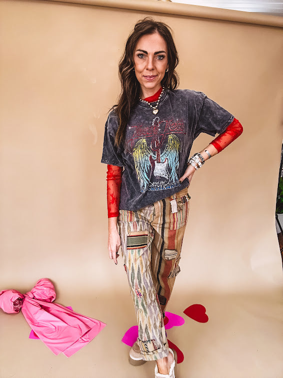 Cotton straight leg ethnic print pants in muted magenta, cream, red, blue and mustard.