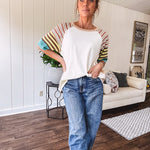 Stripe Mix Cotton Half Sleeve Top. Vibrant striping down the sleeves, exposed seams and a contrasting front and back color blocking, oversized fit and athleisure vibe.