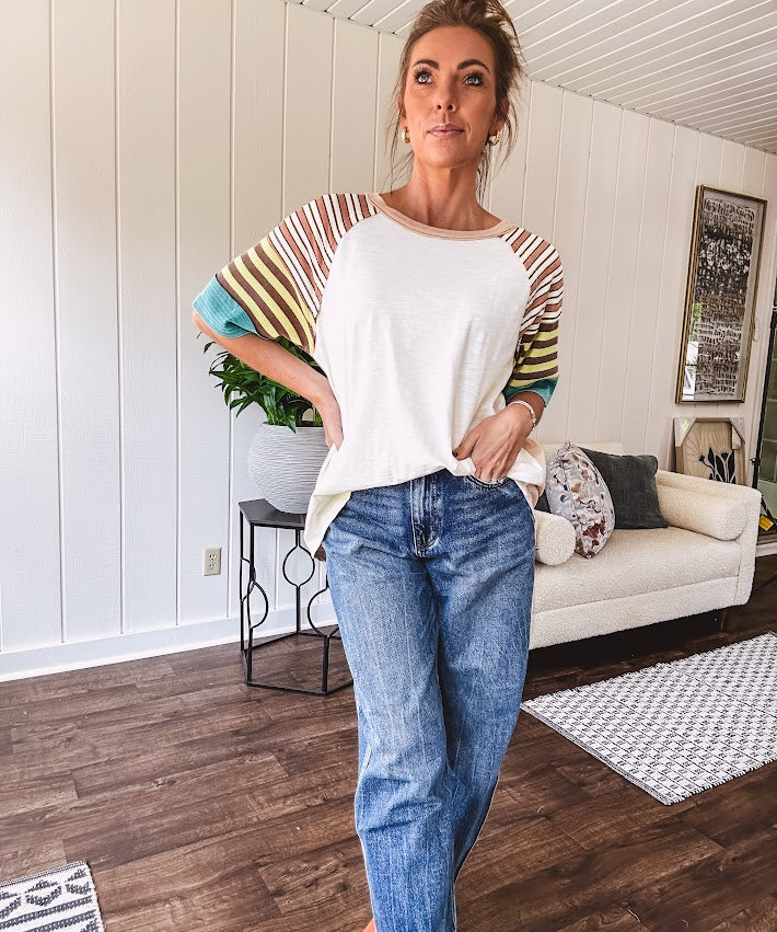 Stripe Mix Cotton Half Sleeve Top. Vibrant striping down the sleeves, exposed seams and a contrasting front and back color blocking, oversized fit and athleisure vibe.
