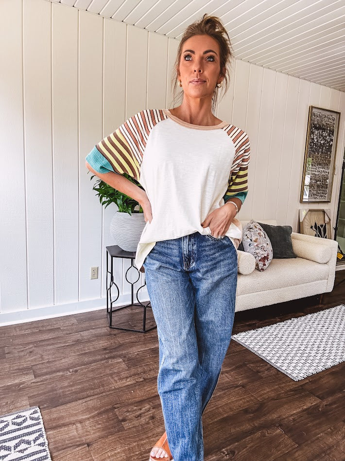 Stripe Mix Cotton Half Sleeve Top. Vibrant striping down the sleeves, exposed seams and a contrasting front and back color blocking, oversized fit and athleisure vibe.